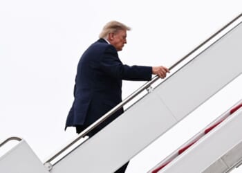 President Donald Trump boards Air Force One on Oct. 3, 2026, at Joint Base Andrews, Maryland.
