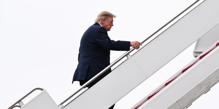 President Donald Trump boards Air Force One on Oct. 3, 2026, at Joint Base Andrews, Maryland.