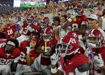 Alabama Crimson Tide players pose with fans after beating the Florida State Seminoles 50-36 at Bryant-Denny Stadium on Sept. 19, 2026 in Tuscaloosa, Alabama. Alabama is scheduled to host the Georgia Bulldogs Saturday at 7:30 p.m. in Tuscaloosa.