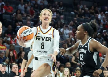 Sophie Cunningham of the Indiana Fever drives to the basket as she is fouled by Chelsea Gray of the Las Vegas Aces in the fourth quarter of Game One of the 2026 WNBA Playoffs first round at Michelob ULTRA Arena on Sept. 27, 2026, in Las Vegas, Nevada.