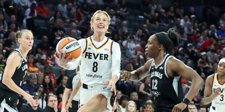 Sophie Cunningham of the Indiana Fever drives to the basket as she is fouled by Chelsea Gray of the Las Vegas Aces in the fourth quarter of Game One of the 2026 WNBA Playoffs first round at Michelob ULTRA Arena on Sept. 27, 2026, in Las Vegas, Nevada.
