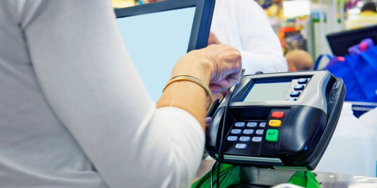 Investigators said the woman used EBT cards at stores and also traded them for illicit drugs.