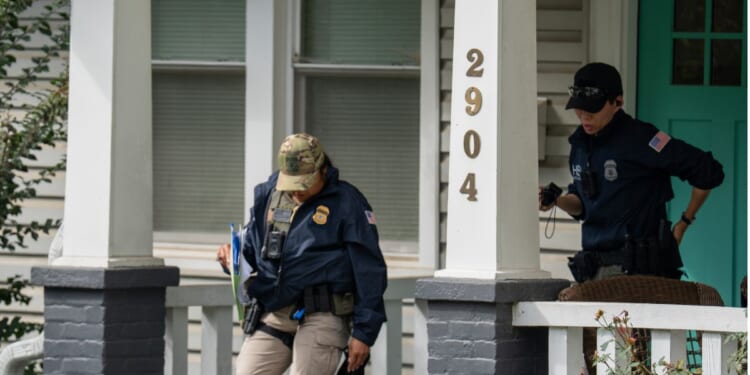 Homeland Security Investigations police search the Washington, D.C. home of Rep. Ilhan Omar, a Minnesota Democrat, Monday.