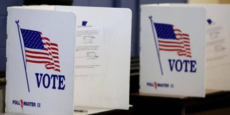 The voting booths stand on a table.