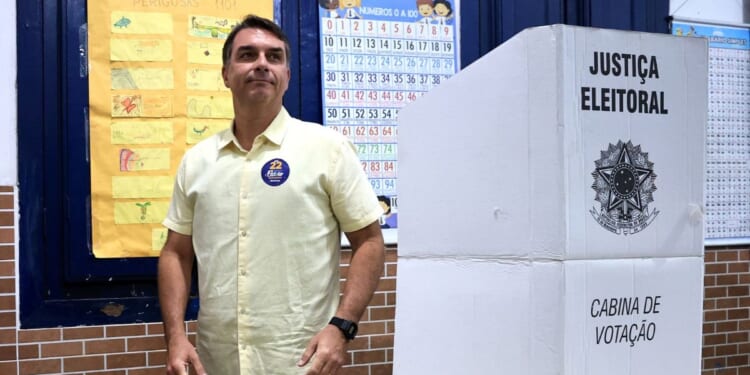 Flavio Bolsonaro, presidential candidate from the Partido Liberal, is pictured at his polling place after casting his vote Sunday during general election day in Rio de Janeiro, Brazil.
