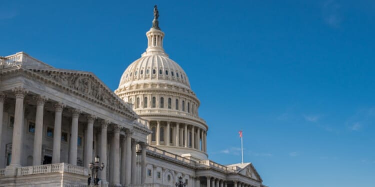 The United States Capitol building stands on a bright day in Washington, D.C.