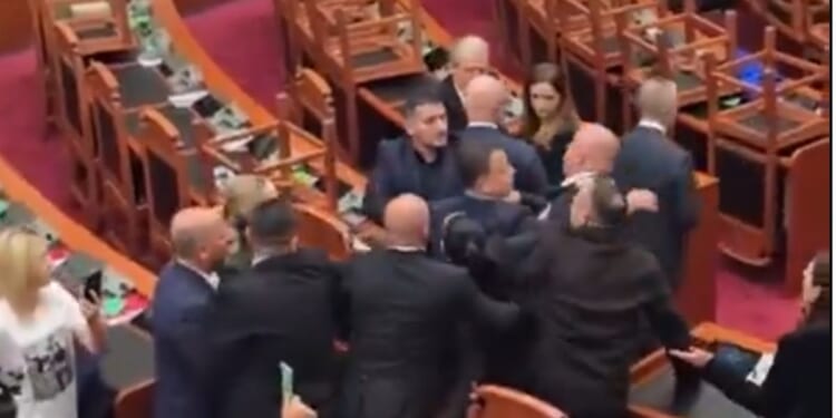 Members of Parliament from the ruling Socialist Party clash with colleagues from the opposition Democratic Party Thursday in Tirana, Albania.