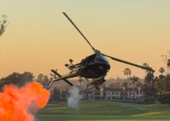 A helicopter drops small explosives at Newport Beach Country Club in California on Oct. 8, 2026.
