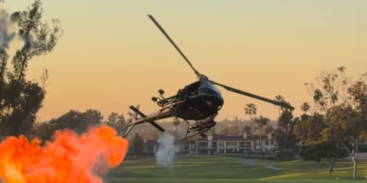 A helicopter drops small explosives at Newport Beach Country Club in California on Oct. 8, 2026.