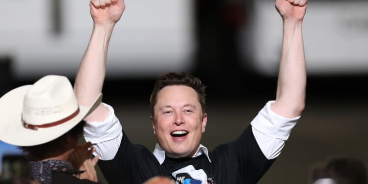 SpaceX founder Elon Musk celebrates after the successful launch of the SpaceX Falcon 9 rocket with the manned Crew Dragon spacecraft at the Kennedy Space Center on May 30, 2020, in Cape Canaveral, Florida.