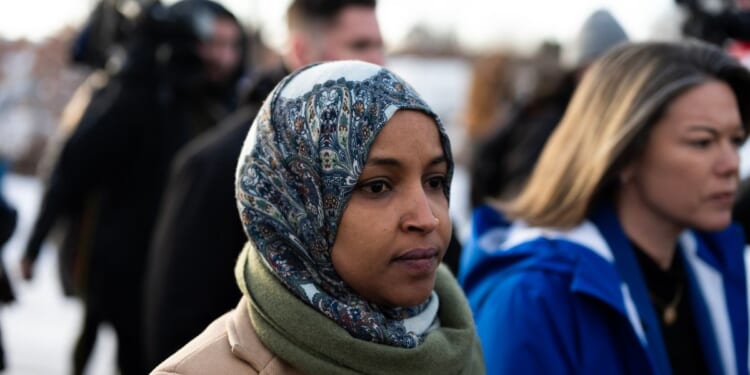 Rep. Ilhan Omar and Rep. Angie Craig arrive outside of the regional ICE headquarters at the Bishop Henry Whipple Federal Building on Jan. 10, 2026, in Minneapolis, Minnesota.