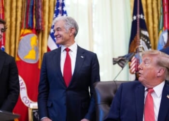 President Donald Trump acknowledges conservative influencer Nick Shirley as Administrator for the Centers for Medicare & Medicaid Services Dr. Mehmet Oz and Vice President J.D. Vance look on during an event in the Oval Office of the White House on Oct. 20, 2026, in Washington, D.C.