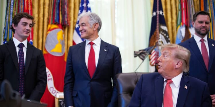 President Donald Trump acknowledges conservative influencer Nick Shirley as Administrator for the Centers for Medicare & Medicaid Services Dr. Mehmet Oz and Vice President J.D. Vance look on during an event in the Oval Office of the White House on Oct. 20, 2026, in Washington, D.C.