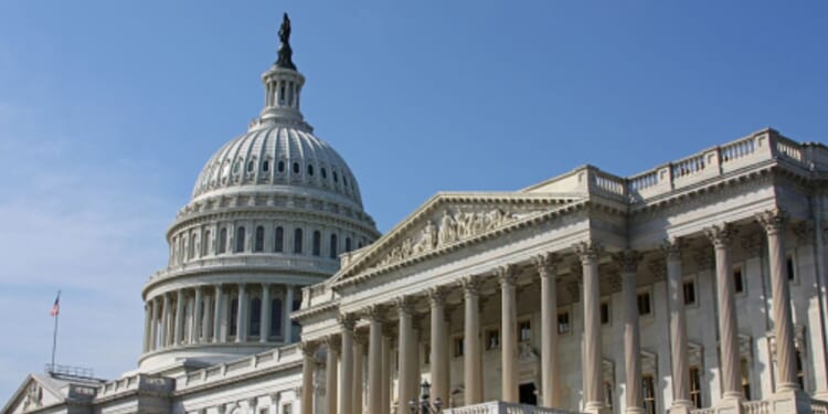 The United States Capitol stands on a sunny day in Washington, D.C.
