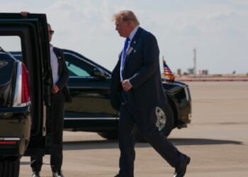 President Donald Trump walks to the presidential limousine nicknamed "The Beast" in a September file photo from the Dallas-Fort Worth Airport.