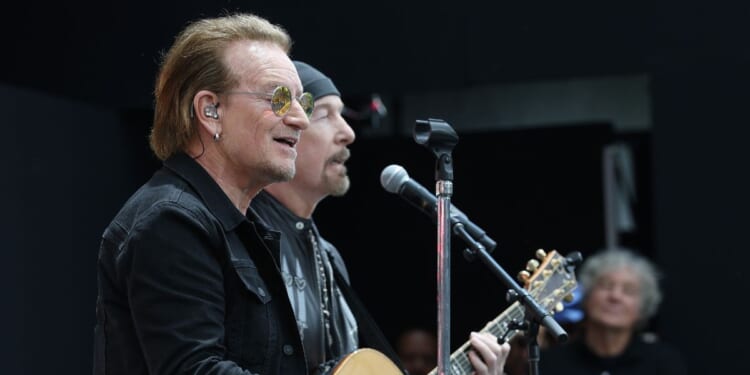 Bono performs during the dedication ceremony for the opening of the Barack Obama Presidential Center in John Lewis Plaza on June 18, 2026, in Chicago, Illinois.