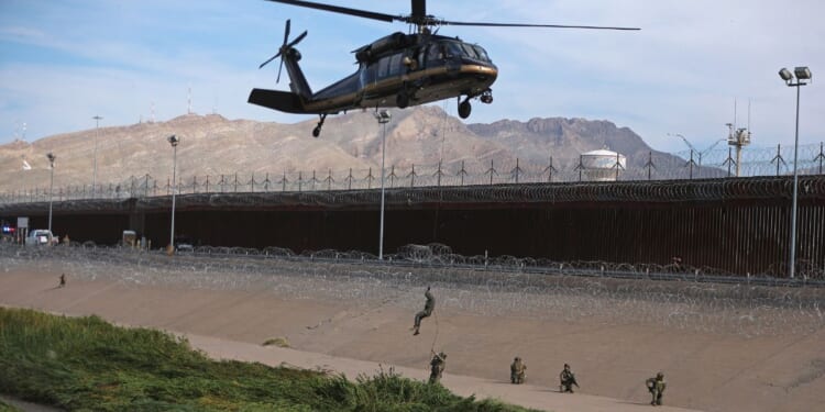 U.S. Customs and Border Protection Air and Marine Operations officers conduct a demonstration with a helicopter of their rapid response capabilities during a joint combined exercise at the border between El Paso, Texas, U.S and Ciudad Juarez, Chihuahua, Mexico, in a file photo from Aug. 13. About 500 U.S. military troops are deploying this week to the Rio Grande Valley in Texas after suspected cartel members shot at a U.S. Coast Guard vessel near Roma over the weekend.