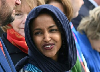 Rep. Ilhan Omar awaits President Joe Biden's arrival at Minneapolis-Saint Paul International Airport in Minneapolis, Minnesota, on April 3, 2023.
