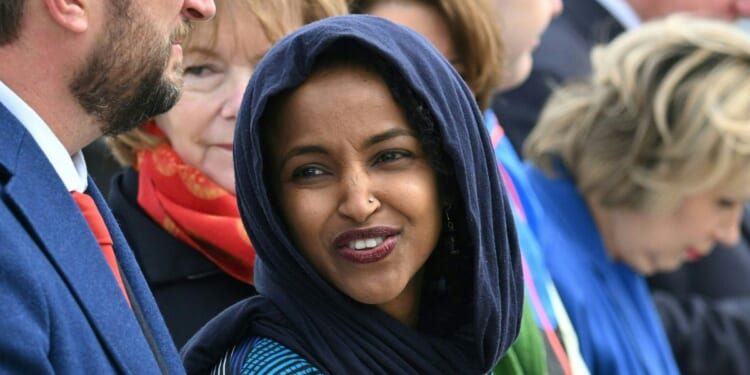 Rep. Ilhan Omar awaits President Joe Biden's arrival at Minneapolis-Saint Paul International Airport in Minneapolis, Minnesota, on April 3, 2023.